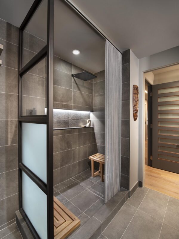 Home 10 Walk in shower with glass partition gray tile walls and wood bench